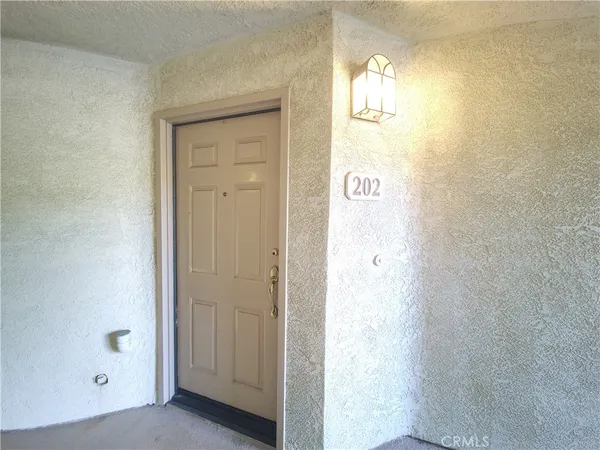 a view of a hallway with front door