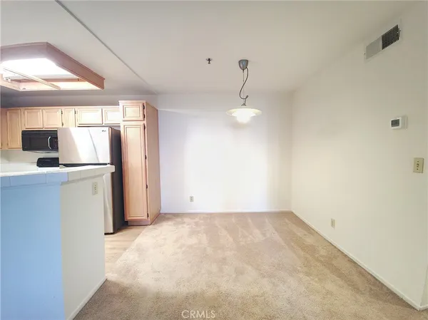 a view of a storage & utility room with a sink