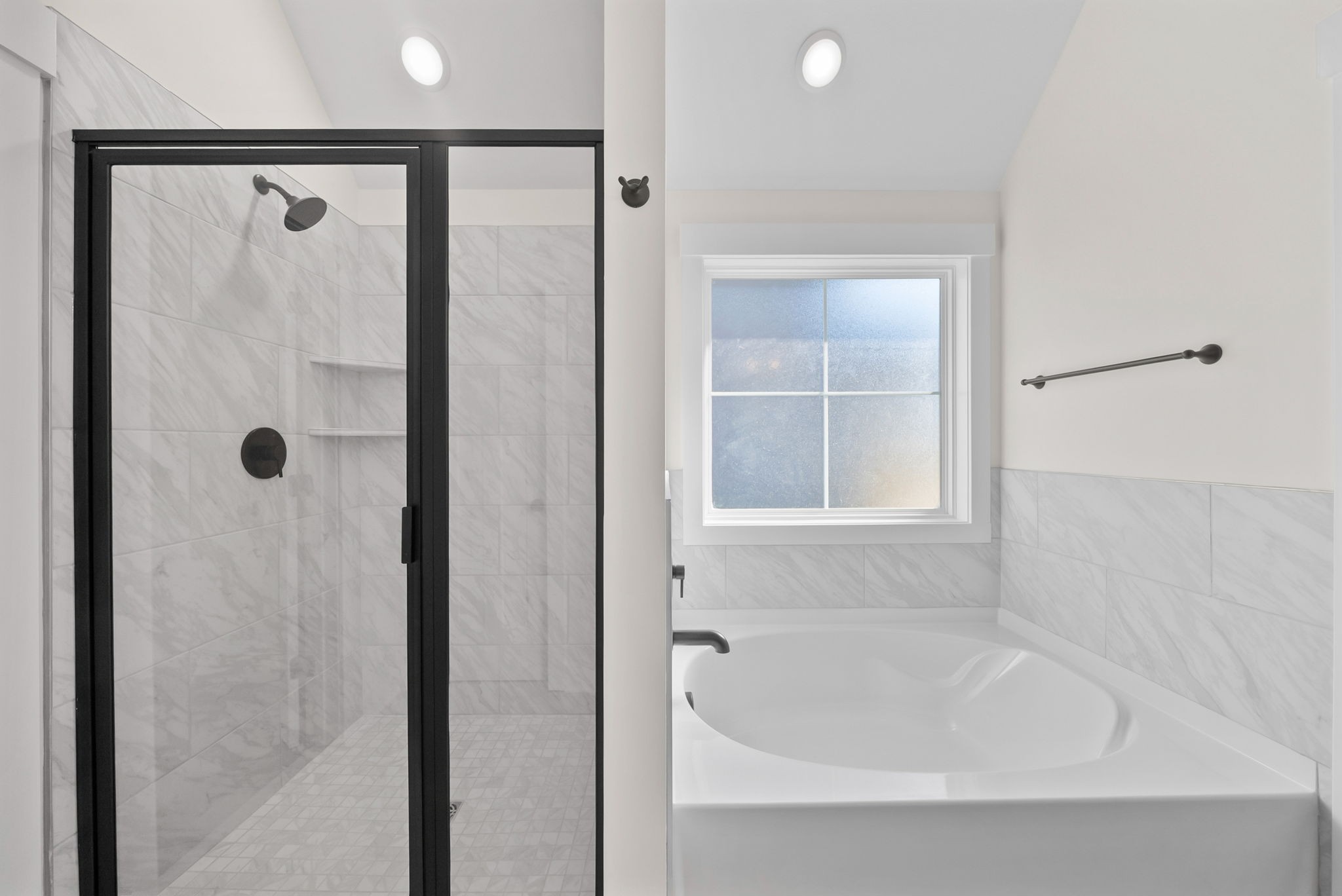 1593 Collins View Way Clarksville, TN 37043 - Photo 22 of 49 a bathroom with a bathtub and a shower