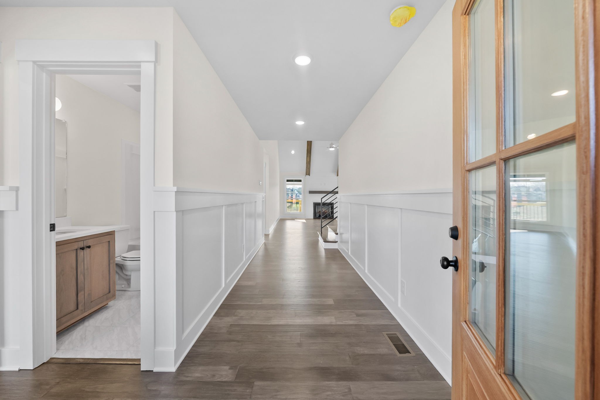 1593 Collins View Way Clarksville, TN 37043 - Photo 4 of 49 a view of a hallway with wooden floor and staircase