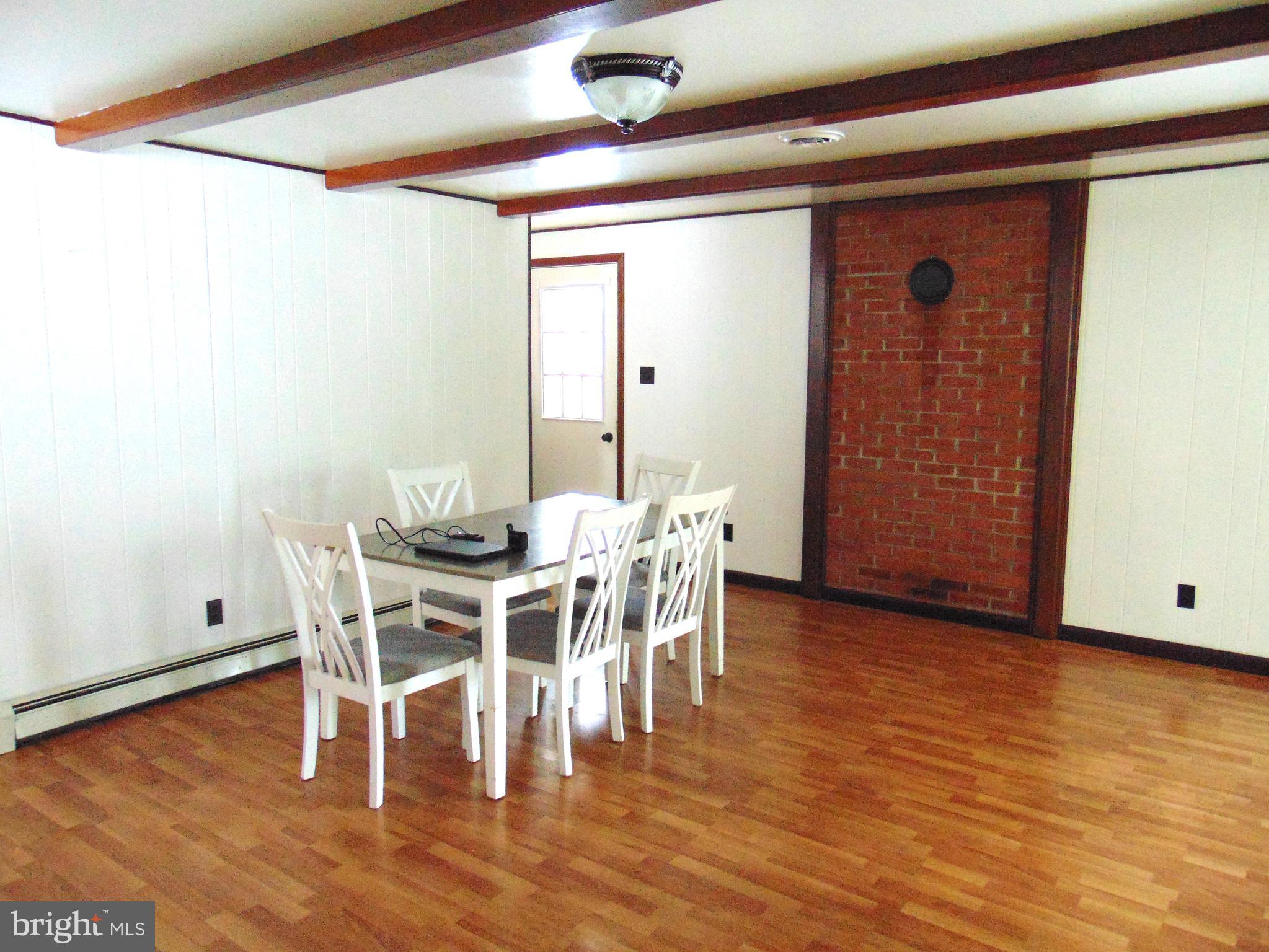2029 Reed Road Knoxville, MD 21758 - Photo 25 of 96 view of formal dining room with brick wall
