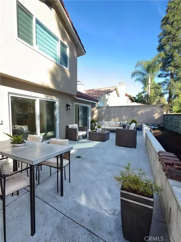 a patio with table and chairs