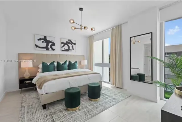 a bedroom with a bed and a mirror