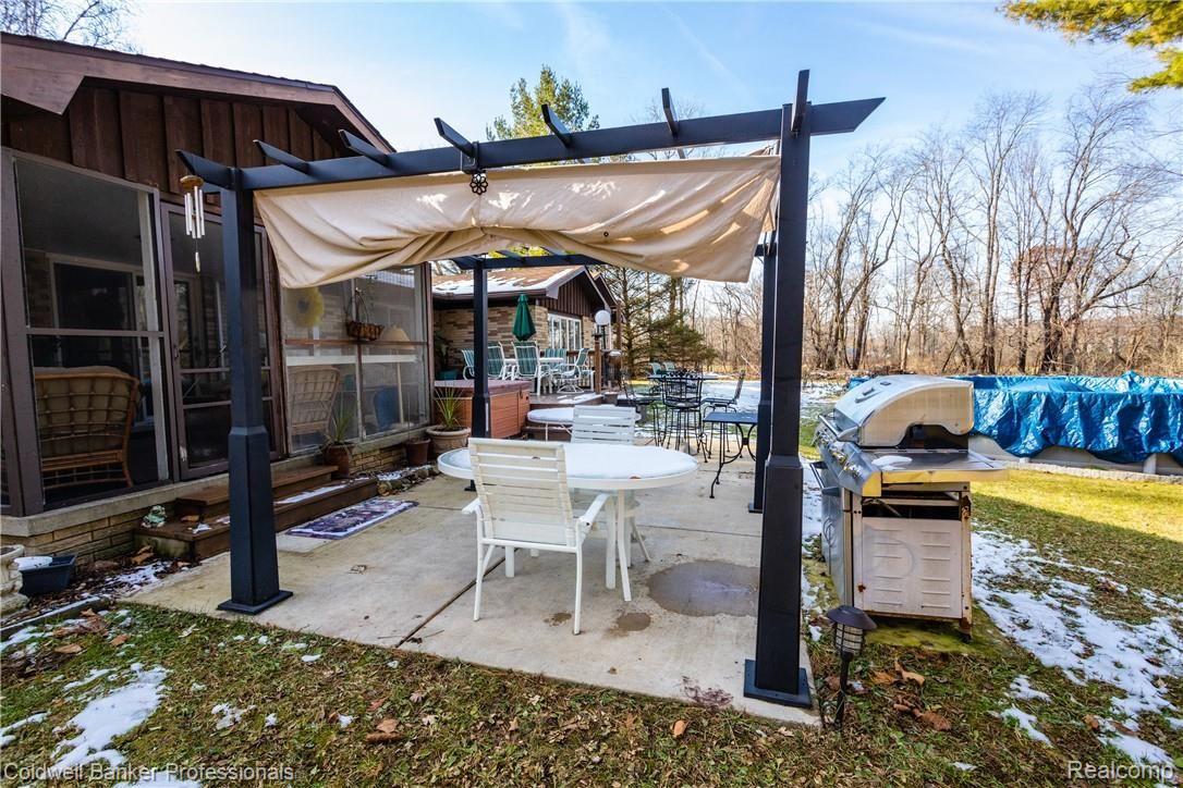 4777 Six Mile Road South Lyon, MI 48178 - Photo 50 of 71 A pergola on the patio protects on sunny days
