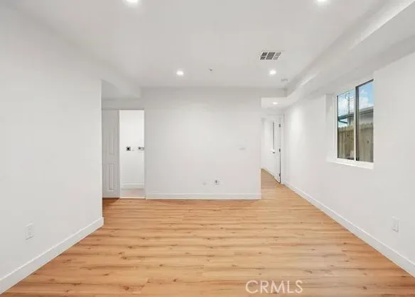 a view of kitchen and kitchen with stainless steel appliances
