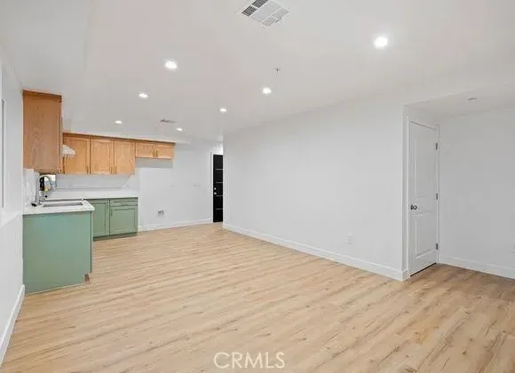 a view of kitchen with wooden floor