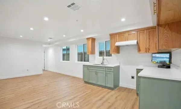 an empty room with wooden floor