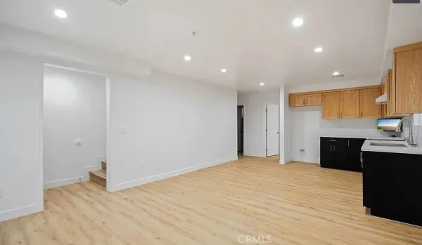 a kitchen with a sink and cabinets