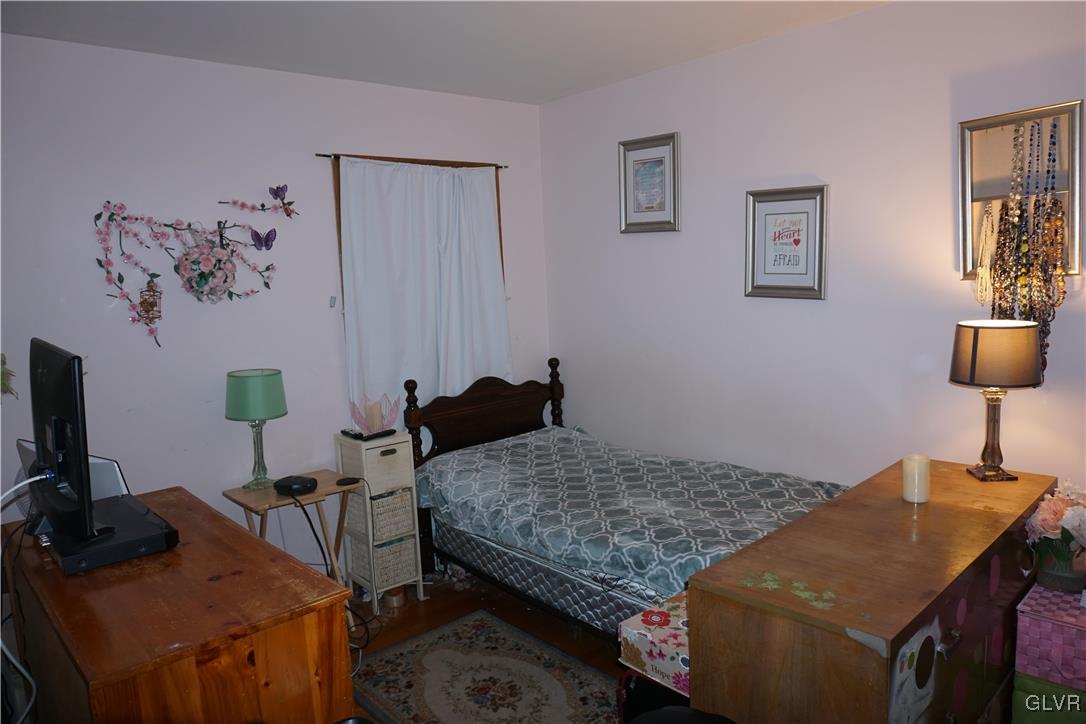 1985 Bathgate Road Bethlehem, PA 18018 - Photo 11 of 22 a bedroom with a bed and a table in it