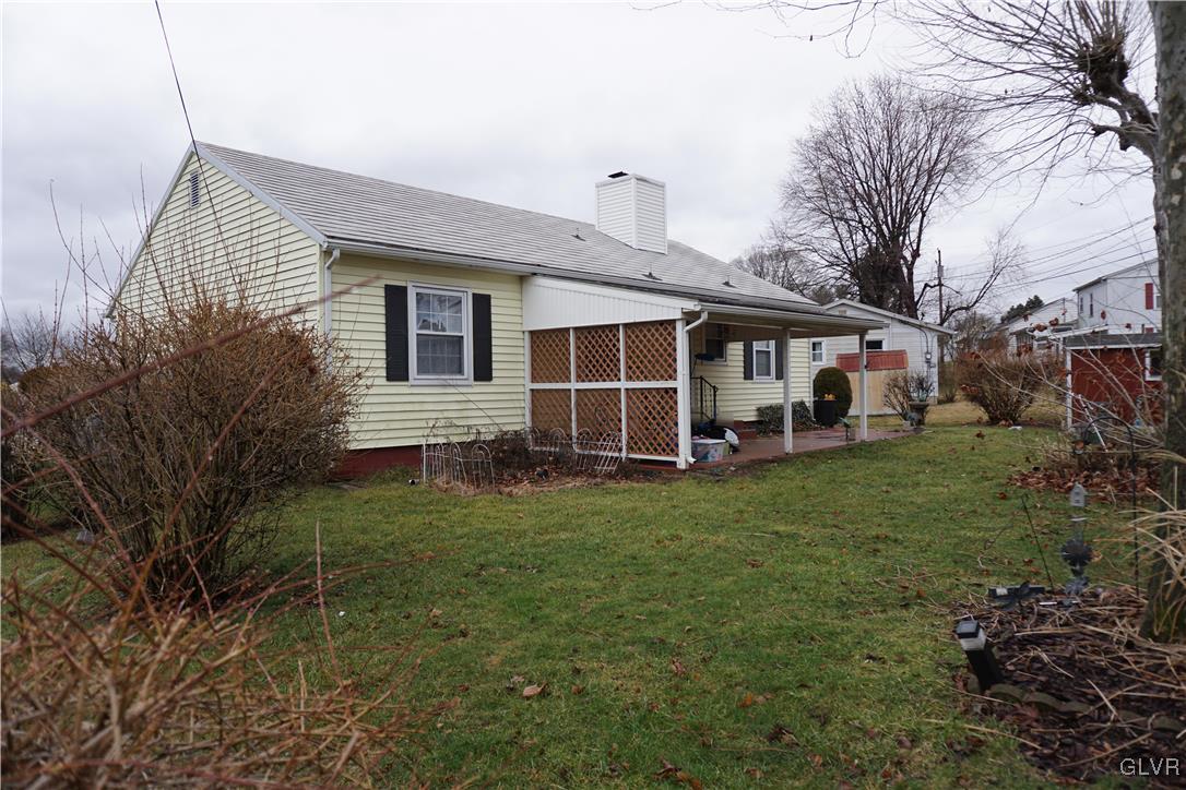 1985 Bathgate Road Bethlehem, PA 18018 - Photo 16 of 22 a view of a yard in front of a house with plants and large tree