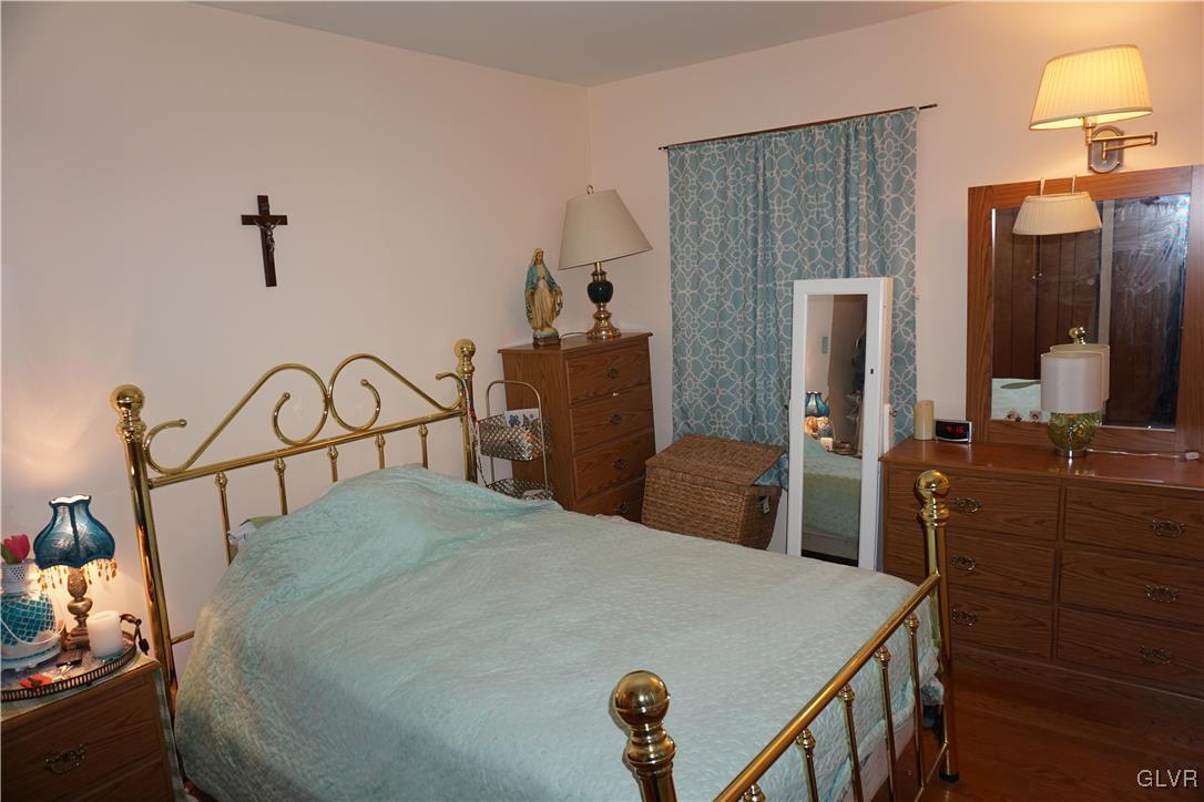 1985 Bathgate Road Bethlehem, PA 18018 - Photo 8 of 22 a bedroom with a bed and a dresser with mirror