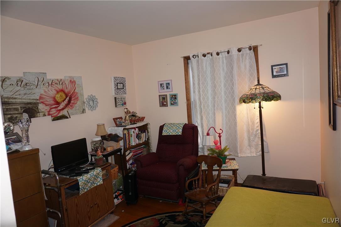 1985 Bathgate Road Bethlehem, PA 18018 - Photo 10 of 22 a room with a couch and a flat screen tv