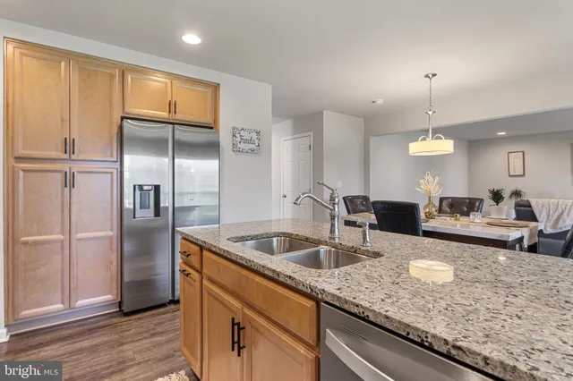a view of an entryway with wooden floor and door