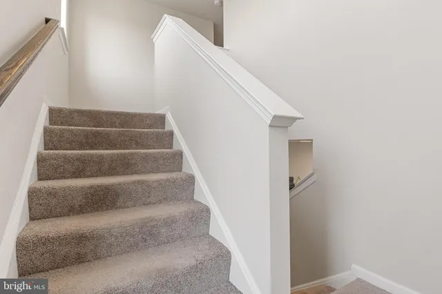 a view of a hallway with a wooden floor