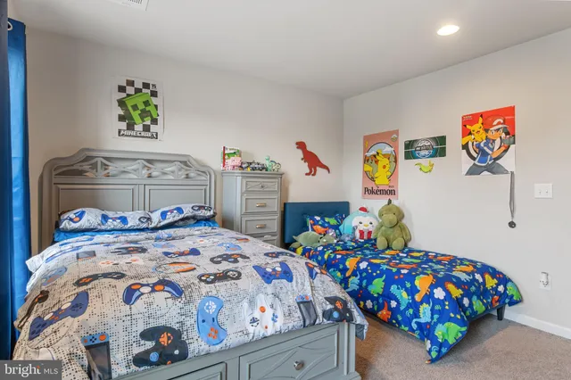 a view of walk in closet with clothes