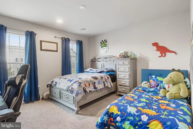 a bathroom with a double vanity sink and a window