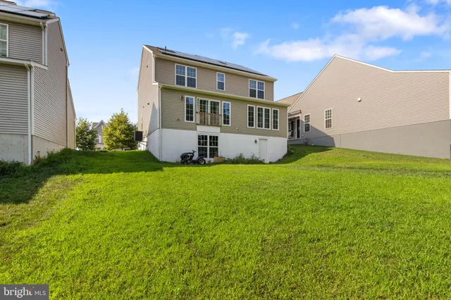 a view of house with yard