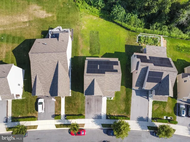 a aerial view of a house with a yard
