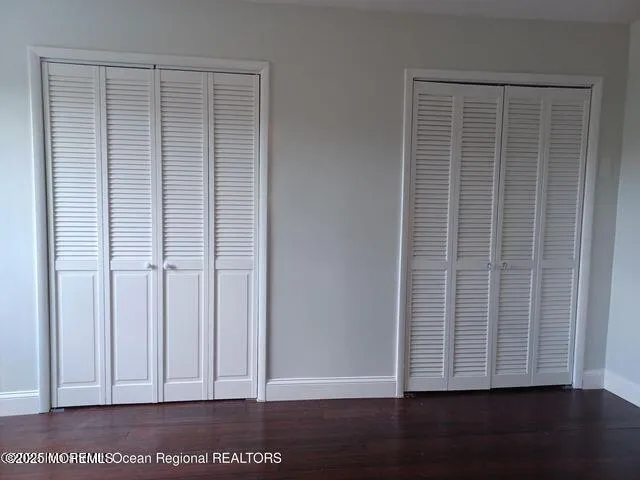 an empty room with wooden floor