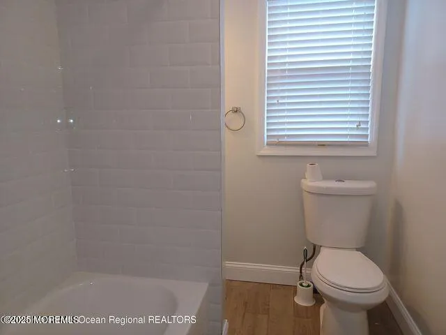 a bathroom with a toilet and a sink
