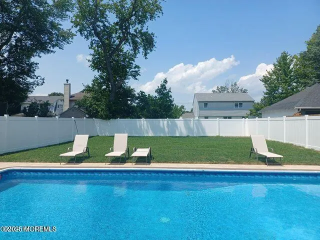 a view of swimming pool outdoor seating