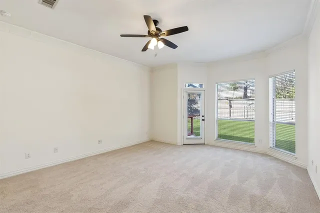 a bathroom with a granite countertop sink mirror vanity and toilet