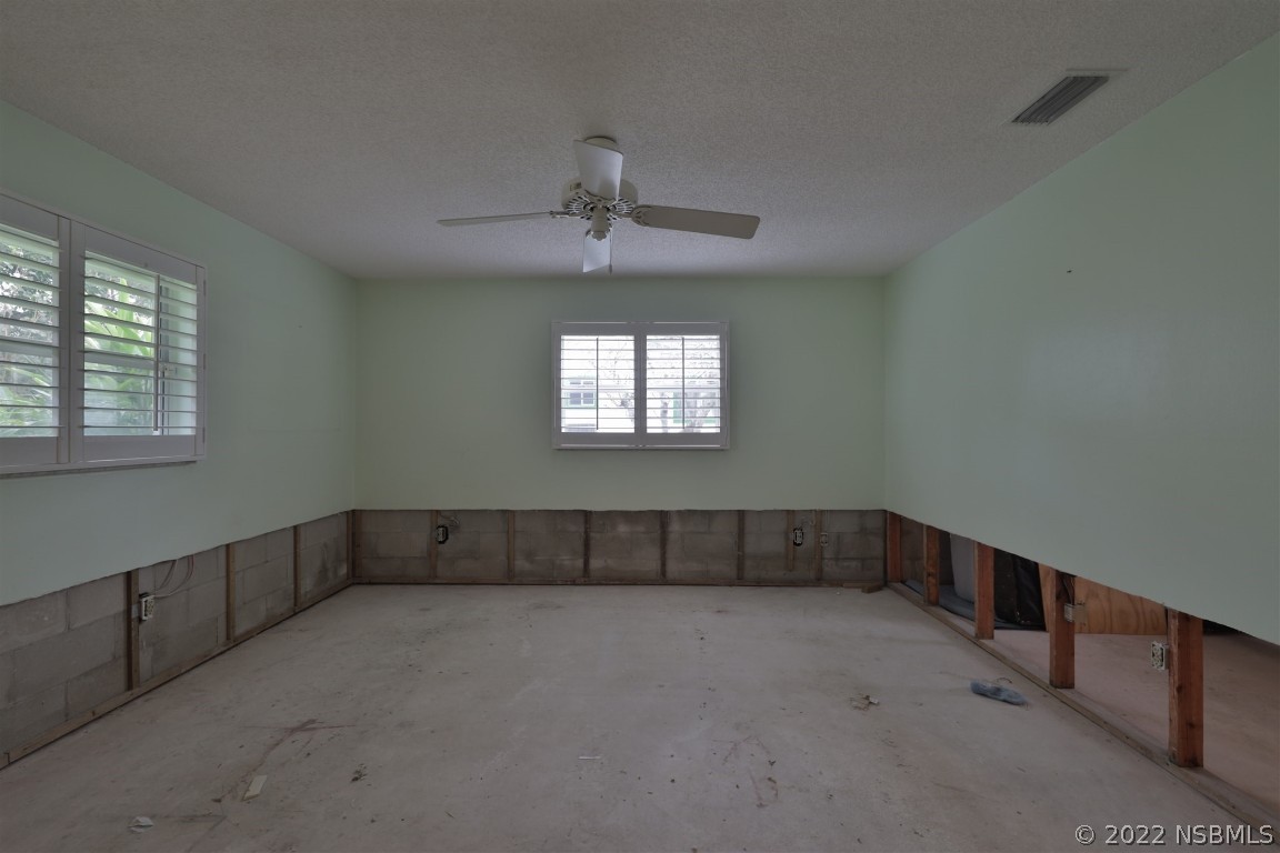1701 Orange Tree Drive Edgewater, FL 32132 - Photo 11 of 21 a view of an empty room with a window