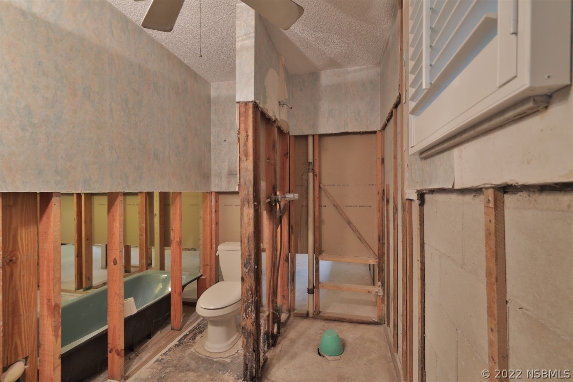1701 Orange Tree Drive Edgewater, FL 32132 - Photo 13 of 21 a bathroom with a toilet and a shower