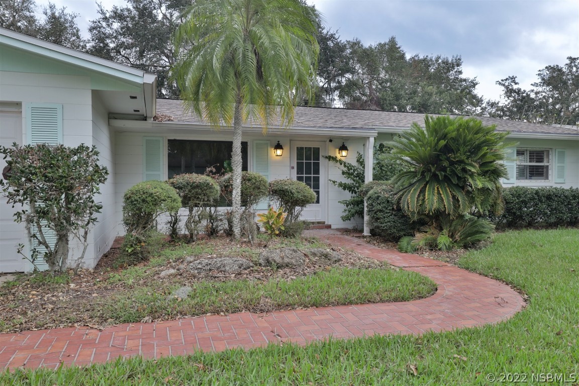 1701 Orange Tree Drive Edgewater, FL 32132 - Photo 5 of 21 a front view of house with yard and green space