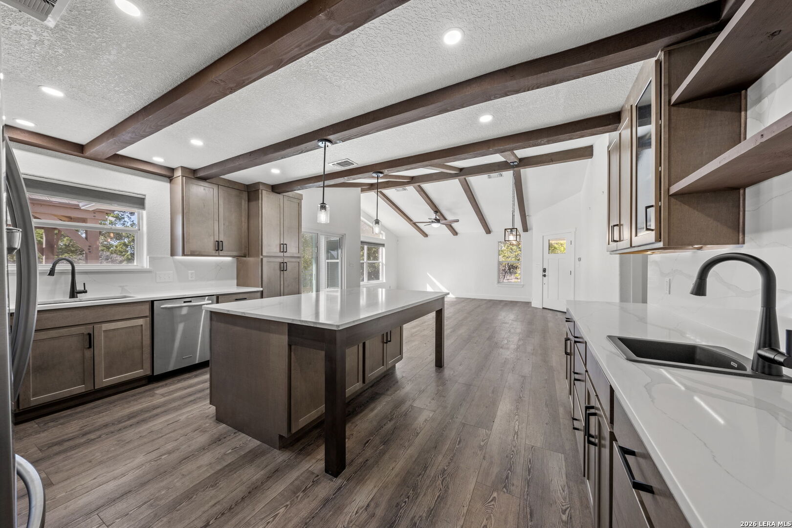 667 Ranch Rim Drive West Ingram, TX 78025 - Photo 13 of 50 a kitchen with stainless steel appliances granite countertop a stove and a sink