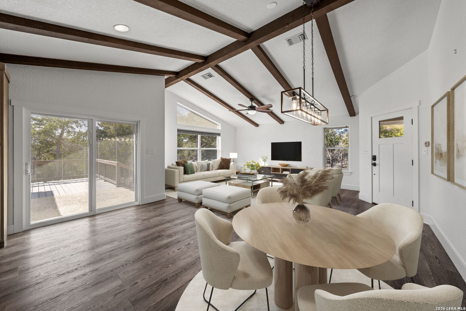 667 Ranch Rim Drive West Ingram, TX 78025 - Photo 15 of 50 a view of a dining room with furniture window and wooden floor