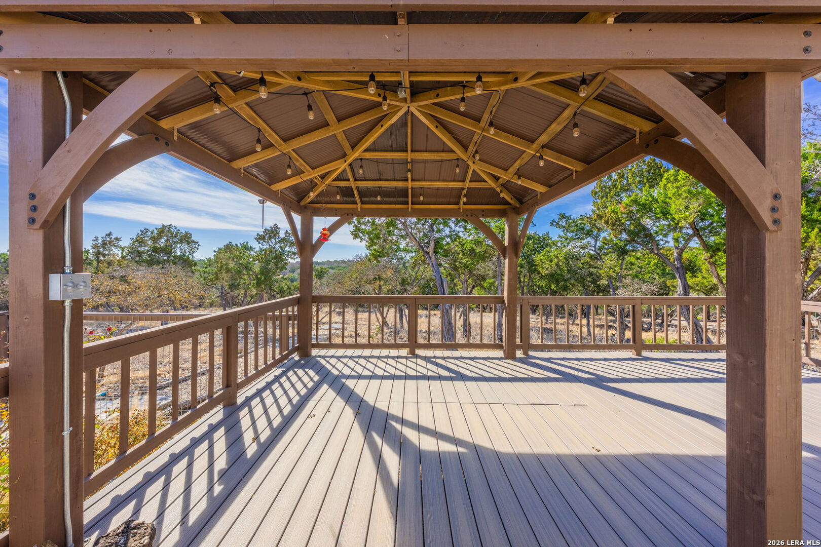667 Ranch Rim Drive West Ingram, TX 78025 - Photo 17 of 50 a view of a balcony with wooden floor