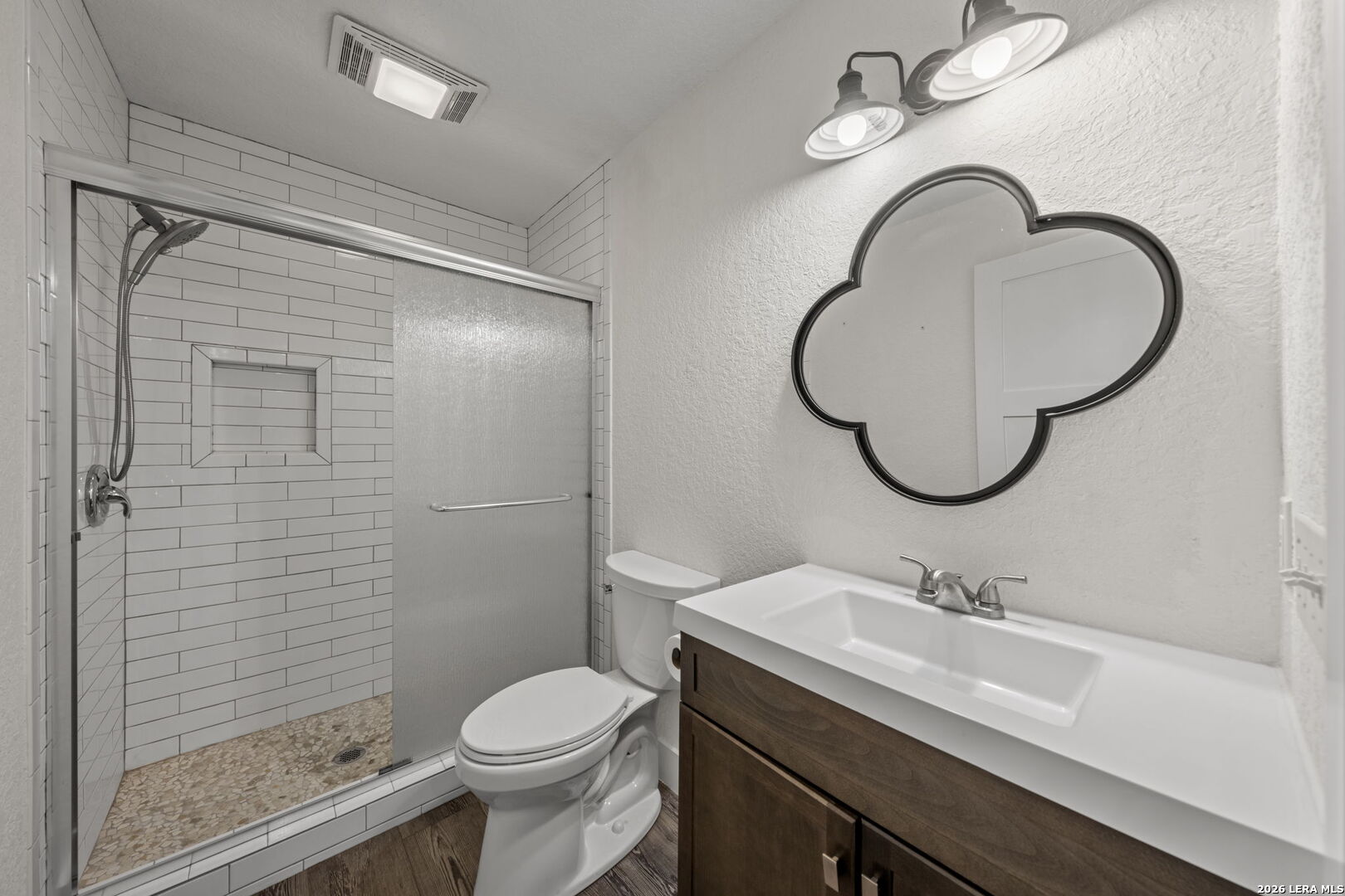 667 Ranch Rim Drive West Ingram, TX 78025 - Photo 24 of 50 a bathroom with a sink toilet and shower