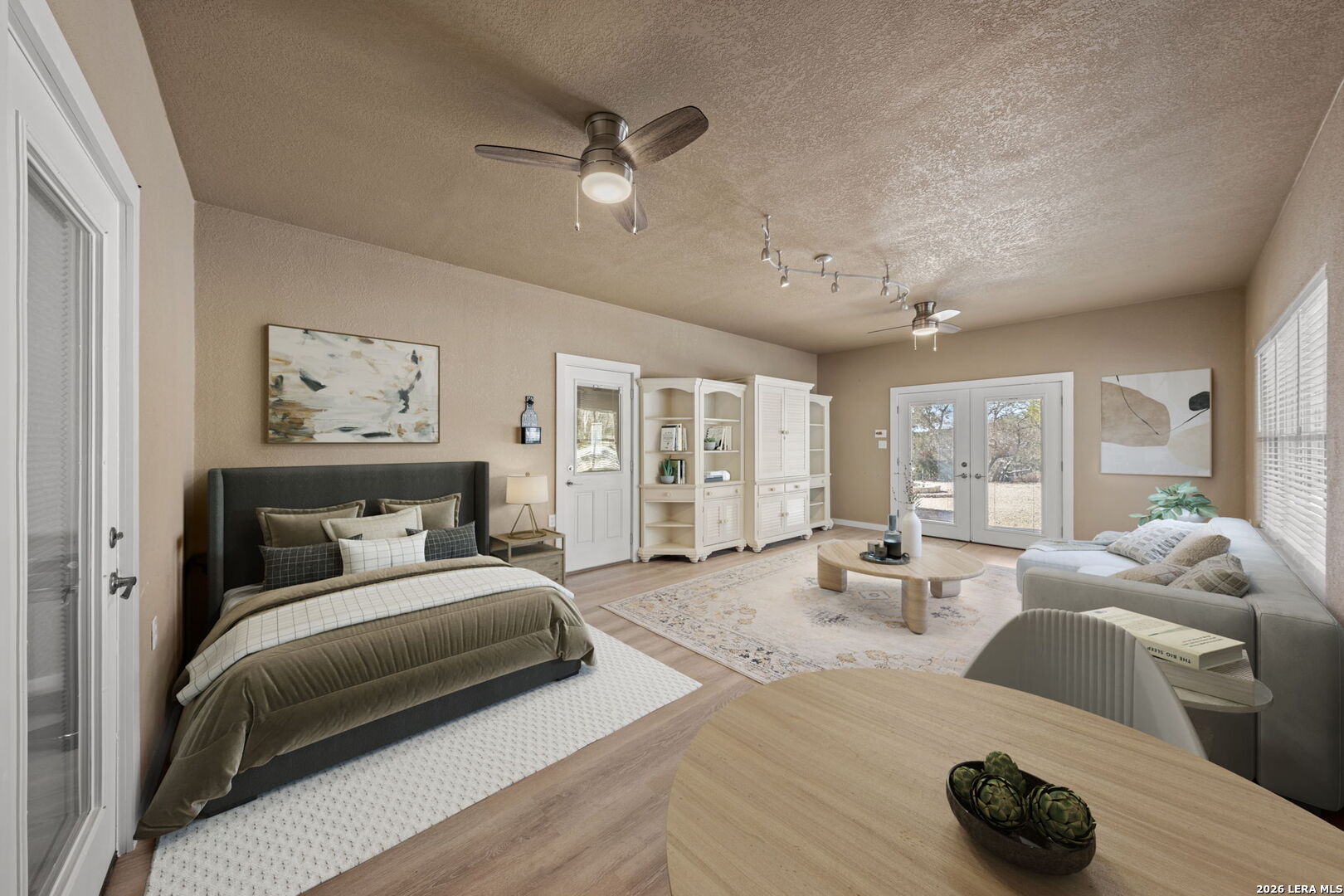 667 Ranch Rim Drive West Ingram, TX 78025 - Photo 31 of 50 a bedroom with furniture and a large window