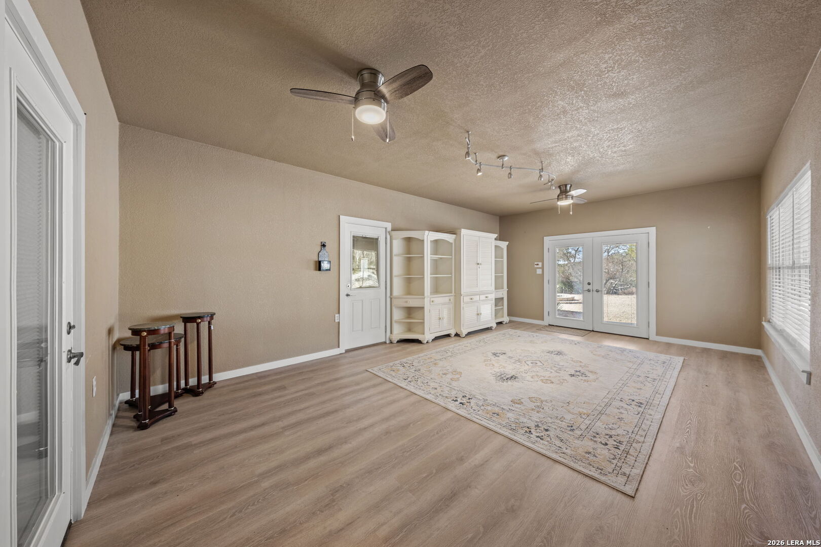 667 Ranch Rim Drive West Ingram, TX 78025 - Photo 32 of 50 a view of an empty room with wooden floor and a window