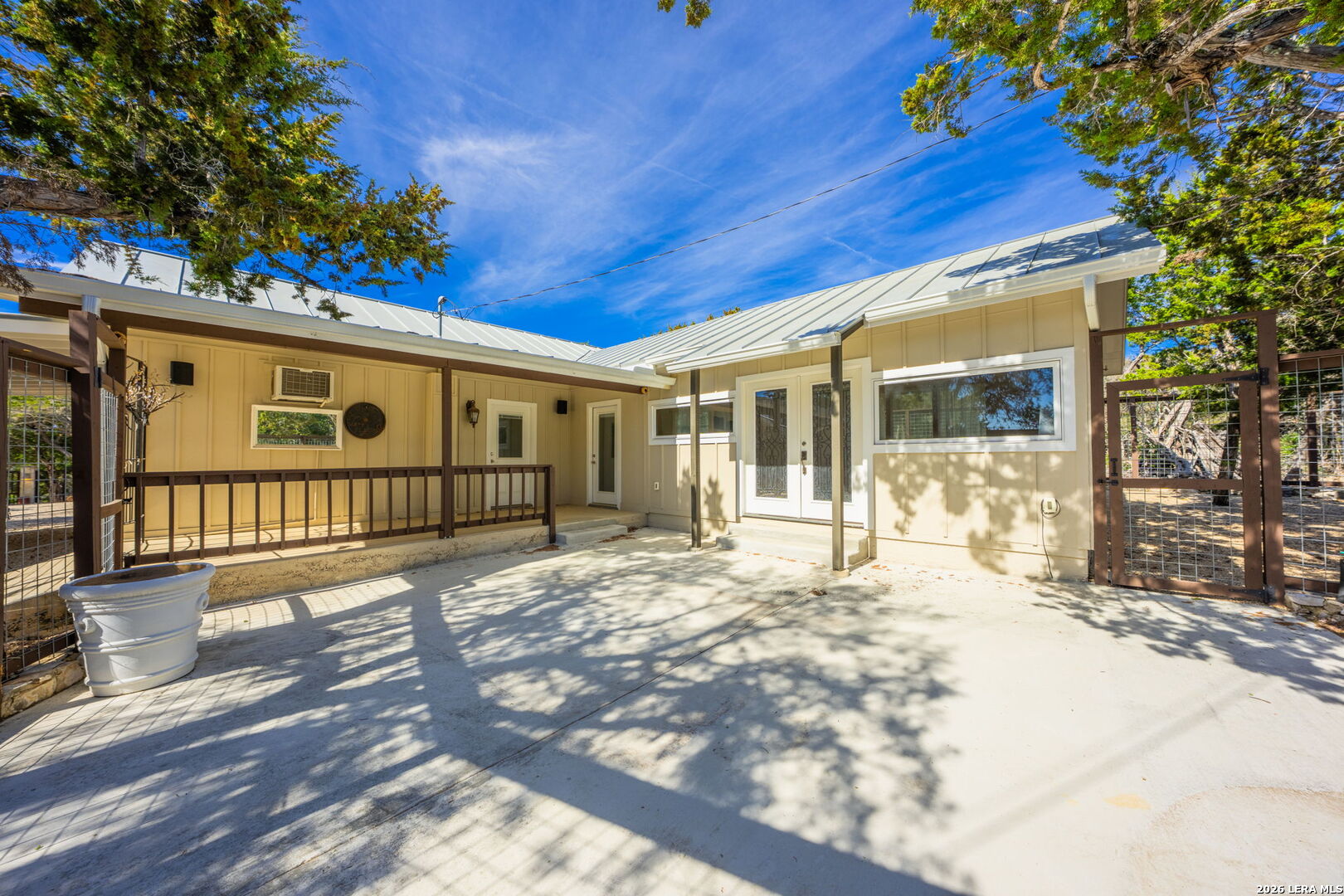 667 Ranch Rim Drive West Ingram, TX 78025 - Photo 40 of 50 a view of a house with a large tree