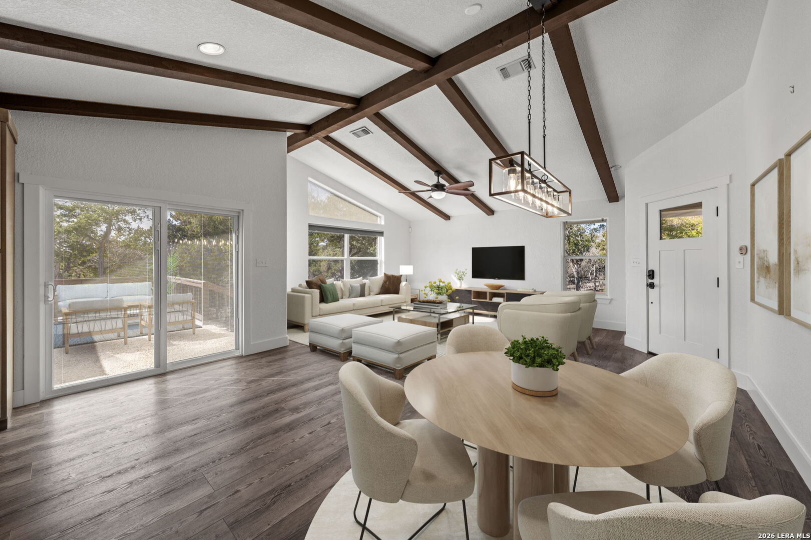 667 Ranch Rim Drive West Ingram, TX 78025 - Photo 4 of 50 a view of a dining room with furniture window and wooden floor