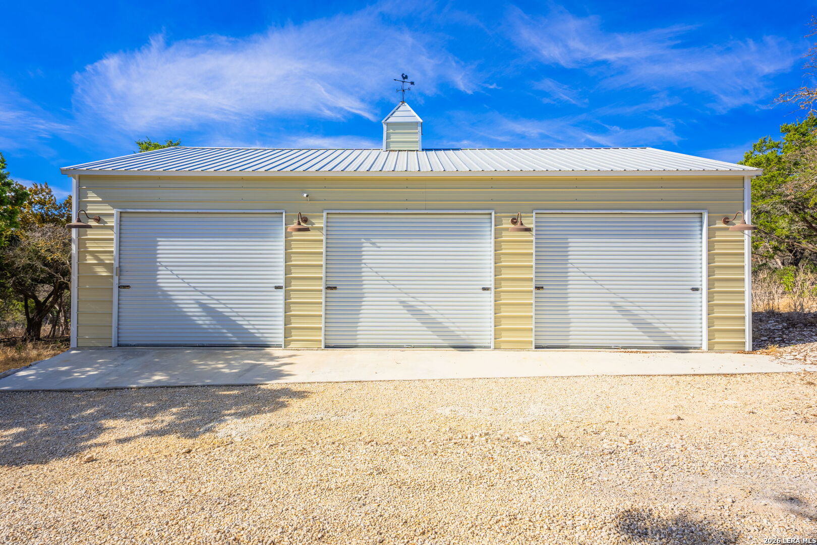667 Ranch Rim Drive West Ingram, TX 78025 - Photo 41 of 50 a front view of a house with a yard and garage