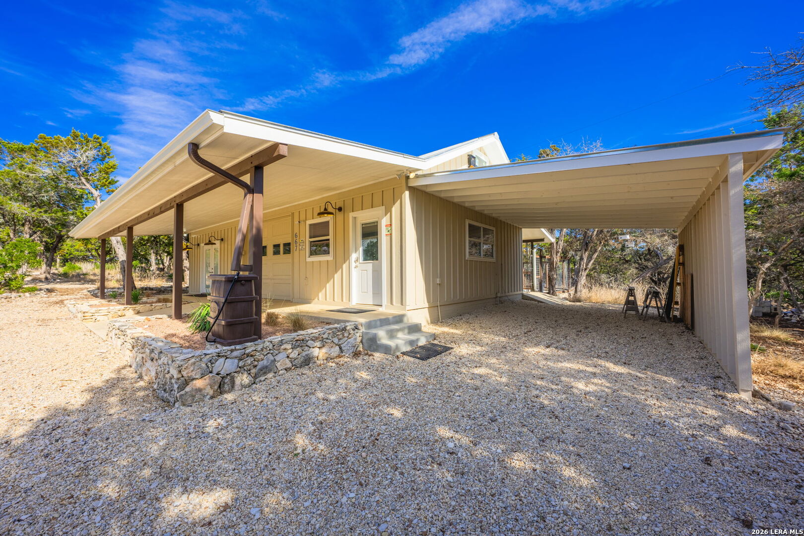 667 Ranch Rim Drive West Ingram, TX 78025 - Photo 47 of 50 a view of a house with patio and wooden fence