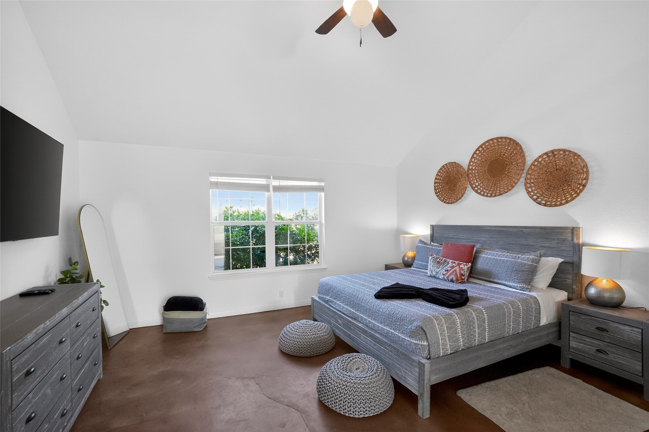 13624 Trautwein Road Austin, TX 78737 - Photo 12 of 38 Slanted ceilings and rich, earthy flooring create a tranquil bedroom environment.