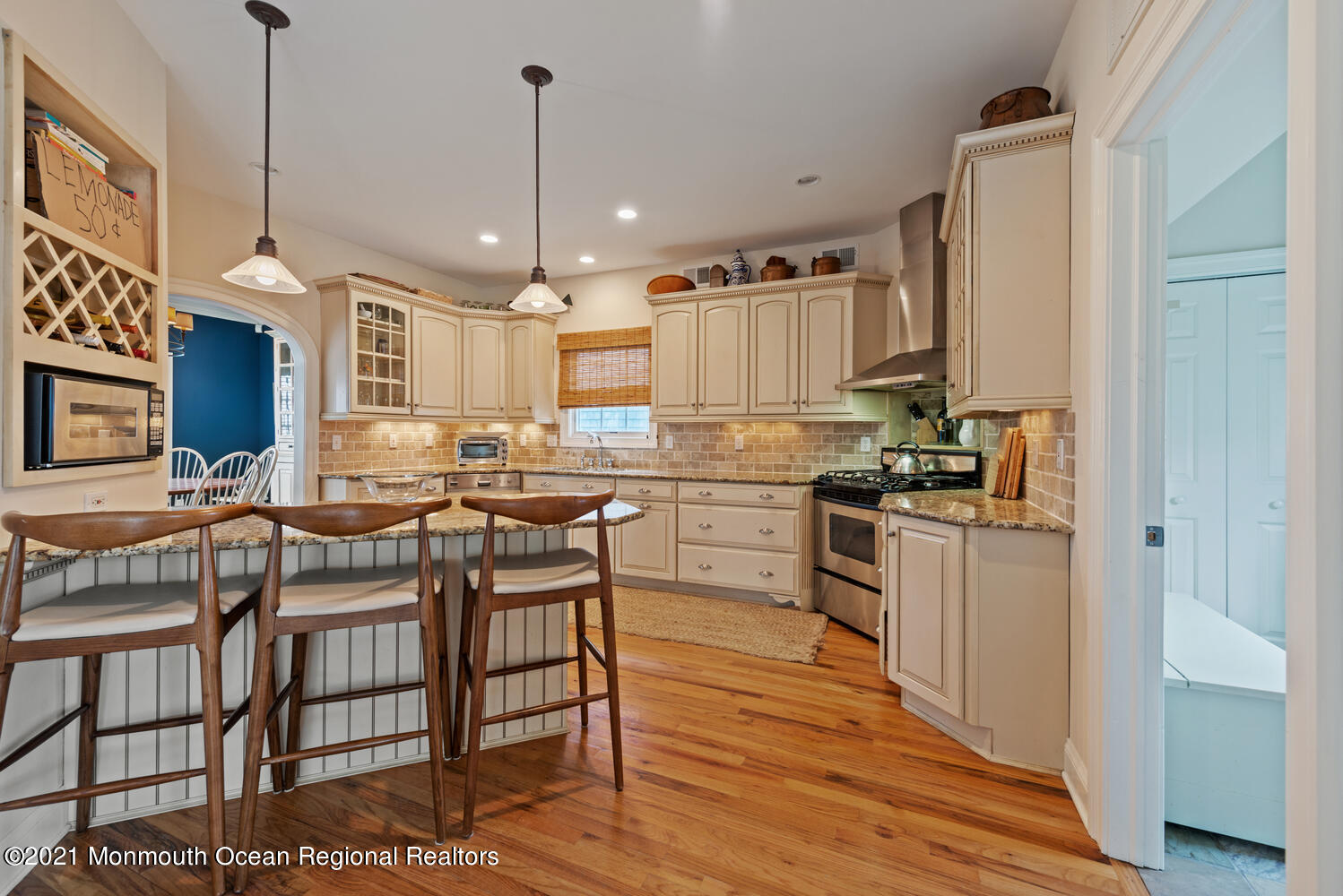 104 3rd Avenue Bradley Beach, NJ 07720 - Photo 13 of 40 a kitchen with stainless steel appliances granite countertop a stove a sink dishwasher a refrigerator white cabinets and wooden floor