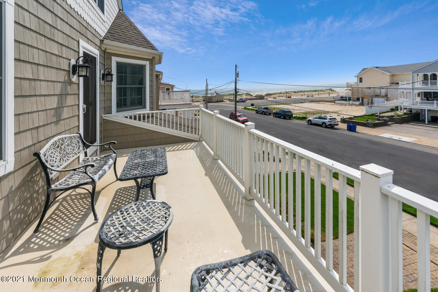 104 3rd Avenue Bradley Beach, NJ 07720 - Photo 17 of 40 a balcony with table and chairs