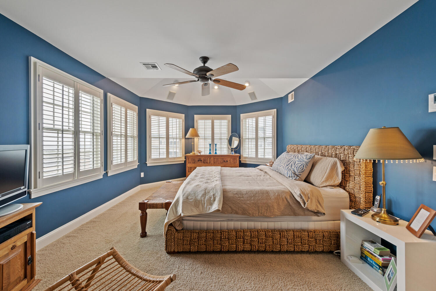 104 3rd Avenue Bradley Beach, NJ 07720 - Photo 19 of 40 a spacious bedroom with a bed and a chandelier