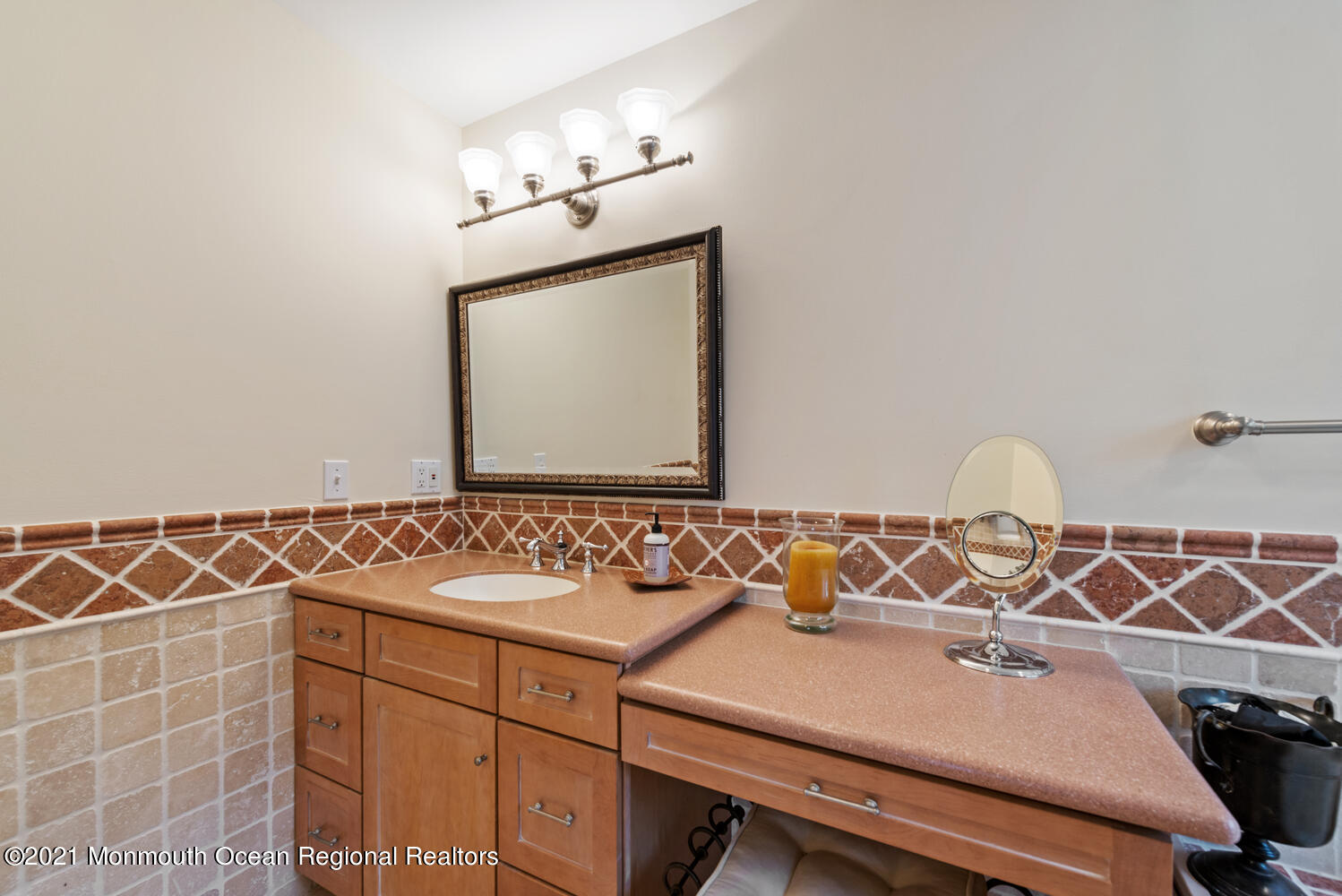 104 3rd Avenue Bradley Beach, NJ 07720 - Photo 21 of 40 a bathroom with a sink and a mirror