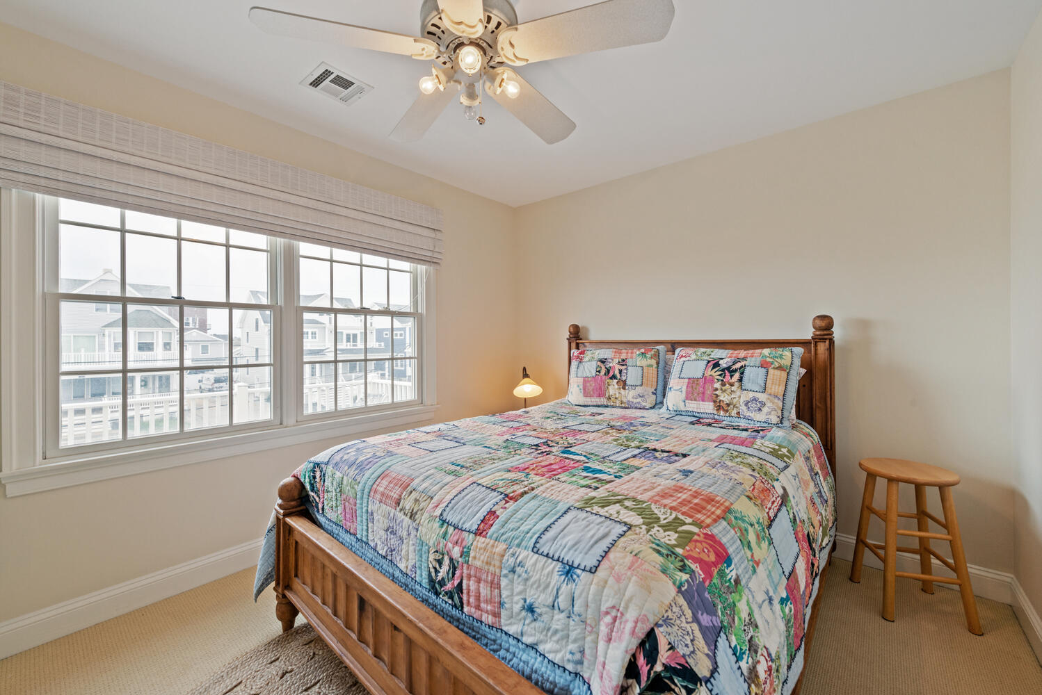 104 3rd Avenue Bradley Beach, NJ 07720 - Photo 22 of 40 a bedroom with a bed and a chandelier