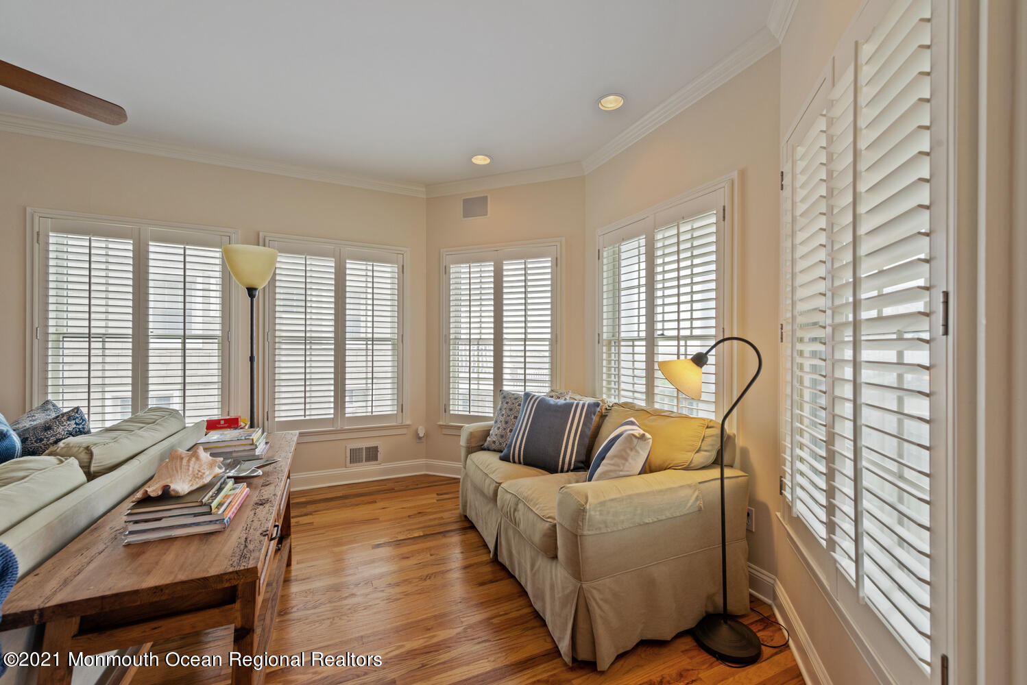 104 3rd Avenue Bradley Beach, NJ 07720 - Photo 8 of 40 a living room with furniture and floor to ceiling windows