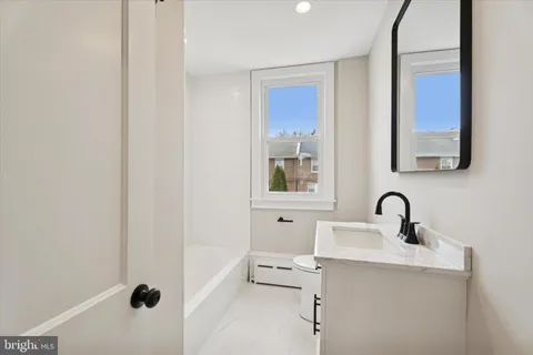 a bathroom with a sink and mirror