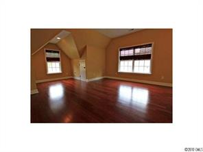 556 Quicksilver Trail Fort Mill, SC 29708 - Photo 13 of 15 a view of an empty room with a window and wooden floor