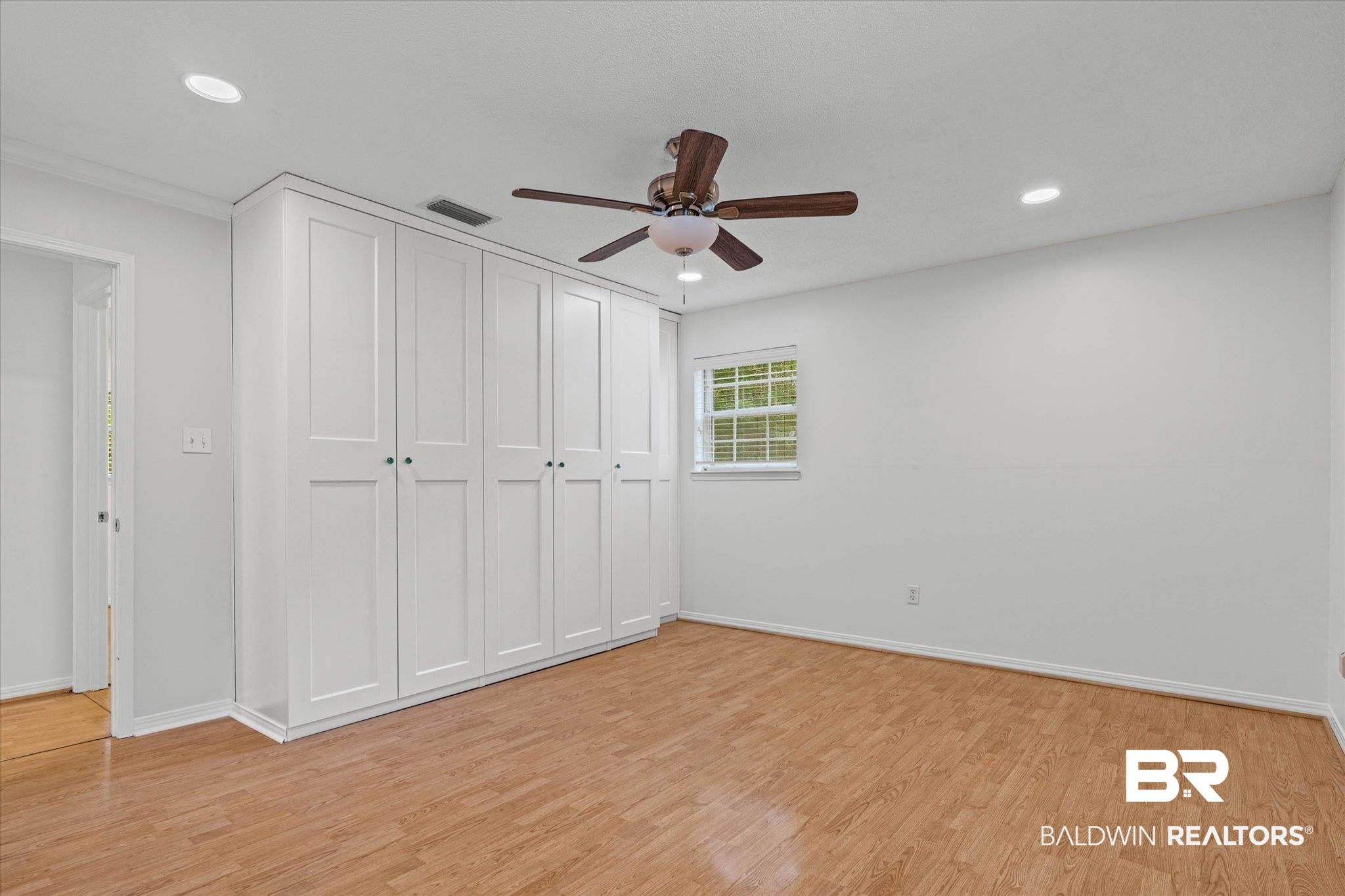 8301 Fordham Road Mobile, AL 36619 - Photo 16 of 57 Spacious interior featuring wood-finish flooring, recessed lighting, and a ceiling fan with light fixture