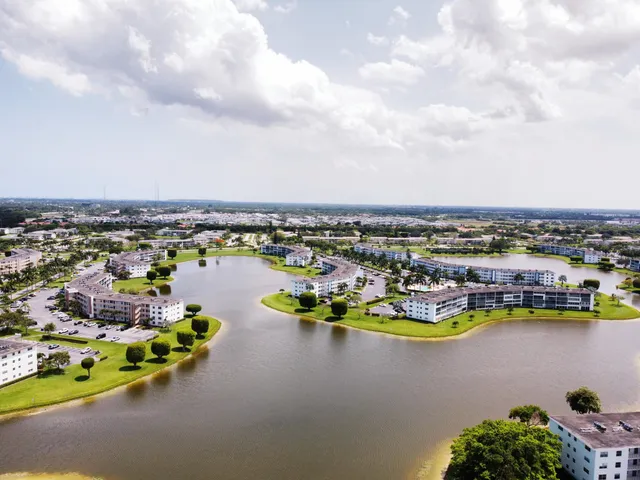 an aerial view of a residential houses with outdoor space